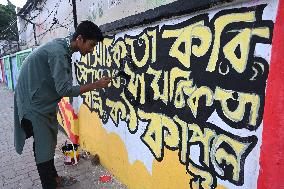 Students Are Painting Graffiti On A Wall Alongside A Road In Dhaka.