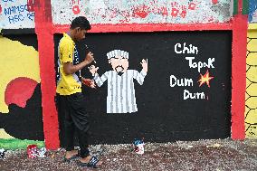 Students Are Painting Graffiti On A Wall Alongside A Road In Dhaka.