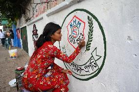 Students Are Painting Graffiti On A Wall Alongside A Road In Dhaka.