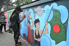 Students Are Painting Graffiti On A Wall Alongside A Road In Dhaka.