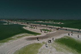 Tourists Visit Qarhan Salt Lake in Haixi