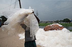 Workers collects polythene in Dhaka