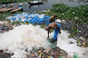 Workers collects polythene in Dhaka