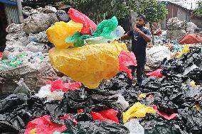 Workers collects polythene in Dhaka