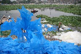 Workers collects polythene in Dhaka