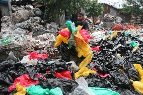 Workers collects polythene in Dhaka