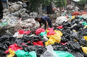 Workers collects polythene in Dhaka