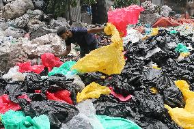 Workers collects polythene in Dhaka