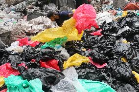 Workers collects polythene in Dhaka