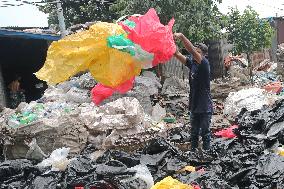 Workers collects polythene in Dhaka