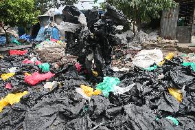 Workers collects polythene in Dhaka