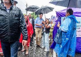 Justin Trudeau greets people as rain falls at Manila festival in Toronto