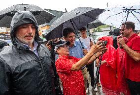 Justin Trudeau greets people as rain falls at Manila festival in Toronto