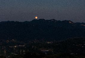 A Supermoon Appears over The Three Gorges Dam in Yichang