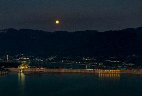 A Supermoon Appears over The Three Gorges Dam in Yichang