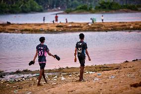 Youth Play A Game Of Football By The Ocean At Sunset In Paruthiyoor