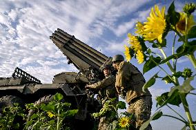 Ukrainian artillerymen fire multiple rocket launcher in Donetsk region