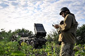 Ukrainian artillerymen fire multiple rocket launcher in Donetsk region