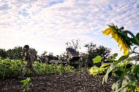 Ukrainian artillerymen fire multiple rocket launcher in Donetsk region