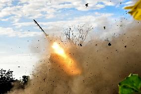 Ukrainian artillerymen fire multiple rocket launcher in Donetsk region