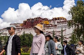 Tourists Visit The Potala Palace in Lhasa