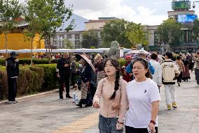 Tourists Visit The Potala Palace in Lhasa