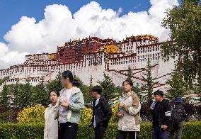 Tourists Visit The Potala Palace in Lhasa