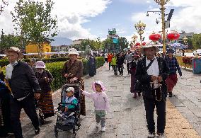 Tourists Visit The Potala Palace in Lhasa