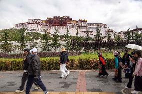 Tourists Visit The Potala Palace in Lhasa