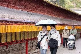 Tourists Visit The Potala Palace in Lhasa