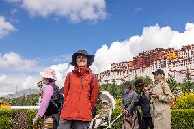 Tourists Visit The Potala Palace in Lhasa