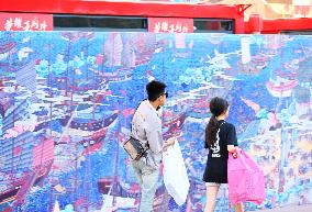 Tourists Visit Wangfujing Pedestrian Street in Beijing