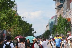 Tourists Visit Wangfujing Pedestrian Street in Beijing