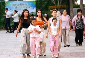 Tourists Visit Wangfujing Pedestrian Street in Beijing