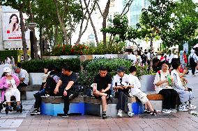 Tourists Visit Wangfujing Pedestrian Street in Beijing