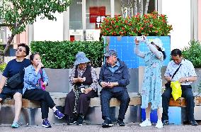 Tourists Visit Wangfujing Pedestrian Street in Beijing