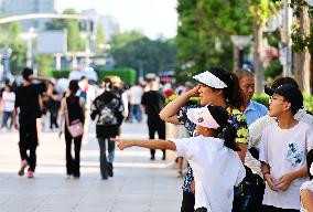 Tourists Visit Wangfujing Pedestrian Street in Beijing