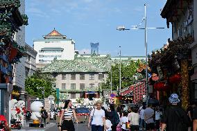 Tourists Visit Wangfujing Pedestrian Street in Beijing