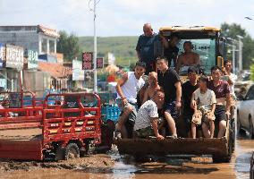 Disastrous Rainstorms Drench Provinces Across China