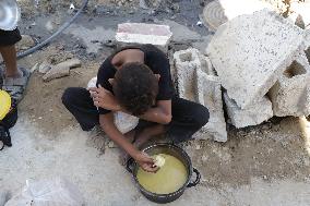 People Receive Food Aid In Jabalia Camp - Gaza