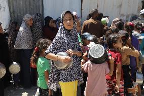 People Receive Food Aid In Jabalia Camp - Gaza