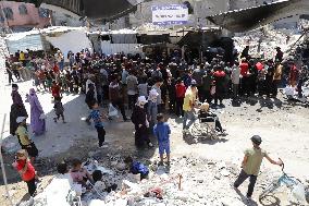 People Receive Food Aid In Jabalia Camp - Gaza