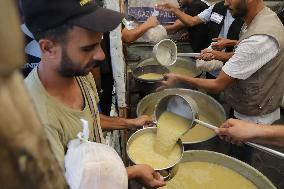 People Receive Food Aid In Jabalia Camp - Gaza