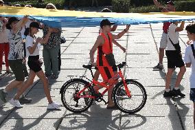 Run with Ukrainian flag in Kyiv