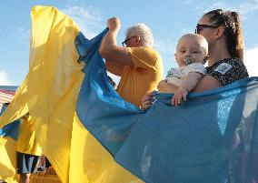 Run with Ukrainian flag in Kyiv