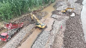 China Anneng Shenyang Rescue Team Repairs A Road in Huludao