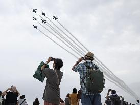 Blue Impulse aerobatic team flies over ASDF base in northeastern Japan