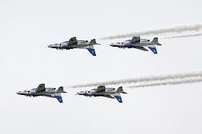 Blue Impulse aerobatic team flies over ASDF base in northeastern Japan