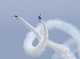 Blue Impulse aerobatic team flies over ASDF base in northeastern Japan