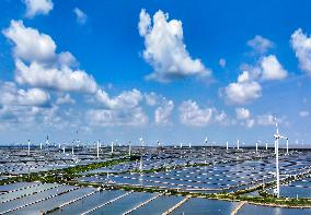 Wind Turbines Rotate in Vast Coastal Flat in Yancheng